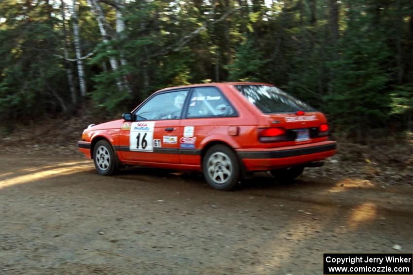 Gail Truess / Pattie Hughes Mazda 323GTX at speed near the finish of SS1, Herman.