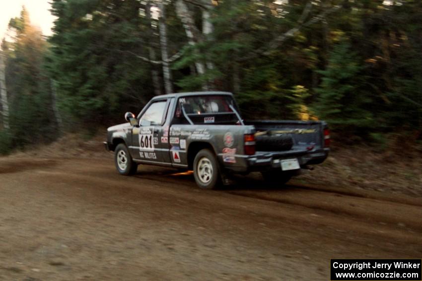 Mike Halley / Emily Burton-Weinman Mitsubishi Mighty Max at speed near the finish of SS1, Herman.