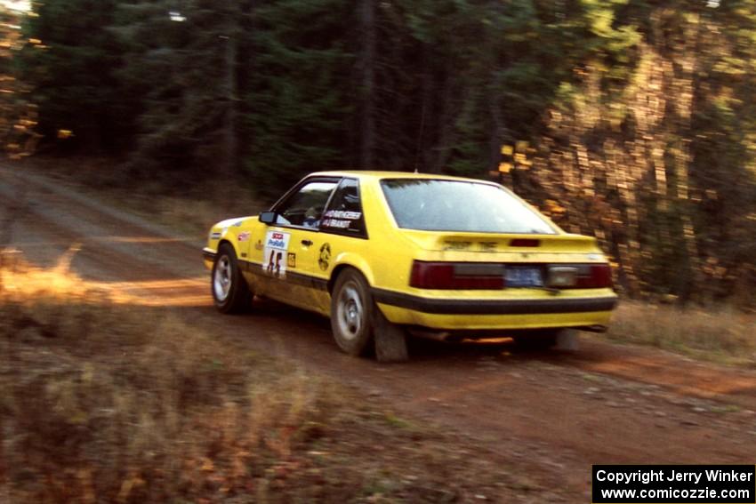 Don Rathgeber / Jimmy Brandt Ford Mustang LX at speed near the finish of SS1, Herman.