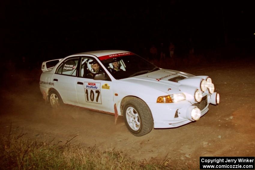 Tim Paterson / Scott Ferguson Mitsubishi Lancer Evo IV at the spectator corner on SS4, Far Point I.