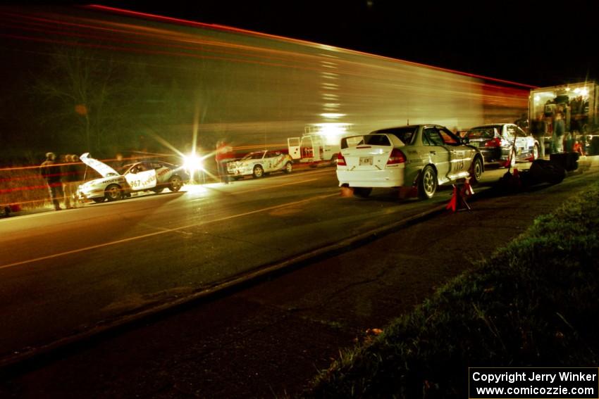 Libra Racing's Hyundai Tiburons on one side of the road with Vermont Sports Car's Mitsubishi Lancer Evos on the other.