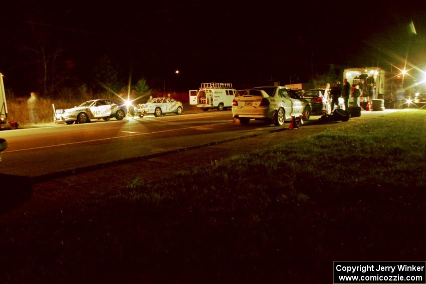 Libra Racing's Hyundai Tiburons on one side of the road with Vermont Sports Car's Mitsubishi Lancer Evos on the other.