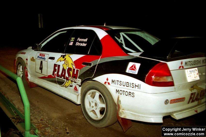 Garen Shrader / Michael Fennell Mitsubishi Lancer Evo IV at speed across the final bridge on SS10, Menge Creek.