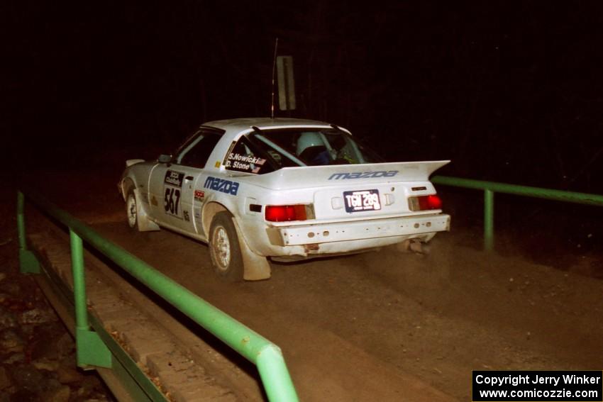 Steve Nowicki / David Stone Mazda RX-7 at speed across the final bridge on SS10, Menge Creek.