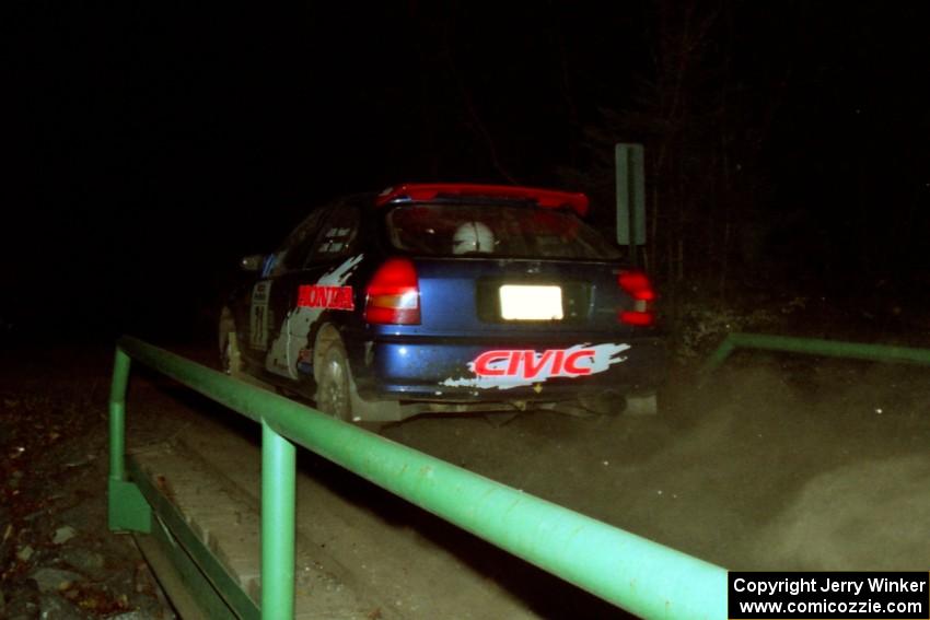 Bryan Hourt / Mike Dunn Honda Civic at speed across the final bridge on SS10, Menge Creek.