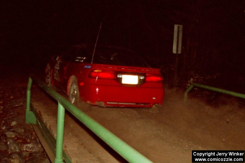 Shane Mitchell / Paul Donnelly Eagle Talon at speed across the final bridge on SS10, Menge Creek.