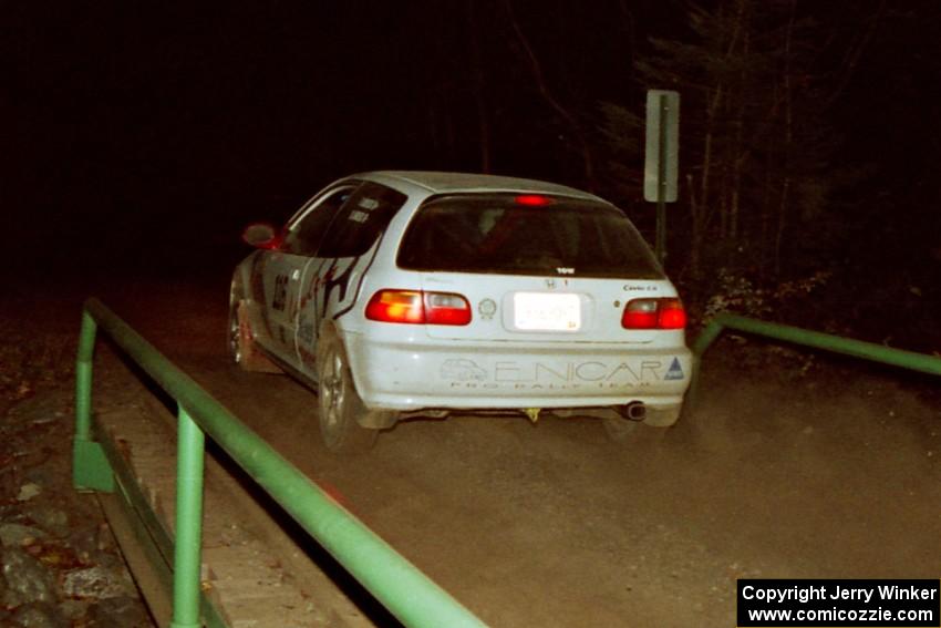 Tom Lawless / Brendan Lawless Honda Civic at speed across the final bridge on SS10, Menge Creek.