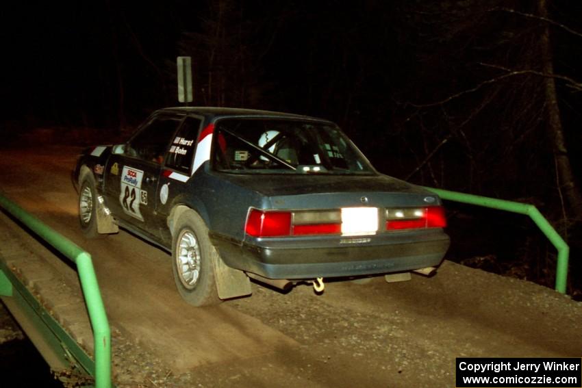 Mike Hurst / Rob Bohn Ford Mustang at speed across the final bridge on SS10, Menge Creek.