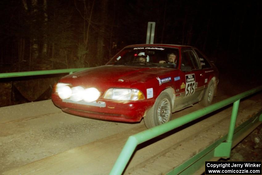 Jeremy Butts / Jon Vrzal Ford Mustang GT at speed across the final bridge on SS10, Menge Creek.