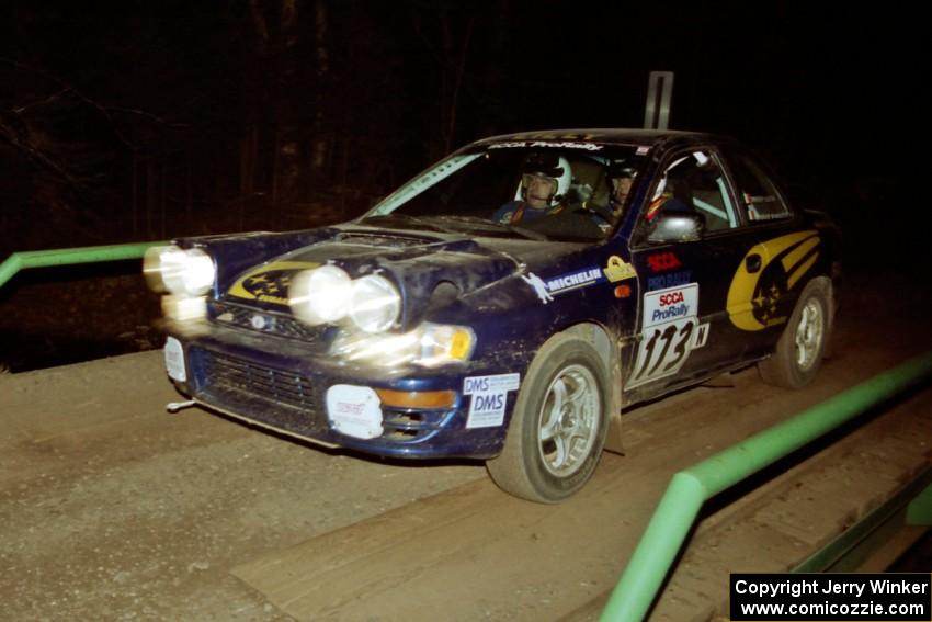 Patrick Lilly / Mark McAllister Subaru WRX at speed across the final bridge on SS10, Menge Creek.