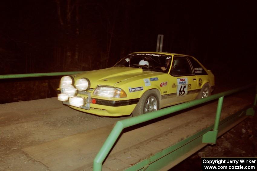 Don Rathgeber / Jimmy Brandt Ford Mustang LX at speed across the final bridge on SS10, Menge Creek.