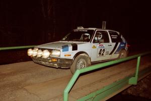 Eric Burmeister / Mark Buskirk VW GTI at speed across the final bridge on SS10, Menge Creek.