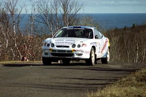 Paul Choiniere / Jeff Becker Hyundai Tiburon at the final yump on SS13, Brockway Mountain.