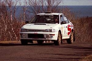 Henry Krolikowski / Cindy Krolikowski Subaru WRX STi at the final yump on SS13, Brockway Mountain.