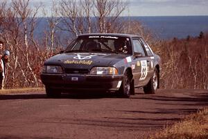 Mike Hurst / Rob Bohn Ford Mustang at the final yump on SS13, Brockway Mountain.