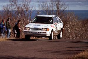 Mark Tabor / Kevin Poirier Mazda 323GTX at the final yump on SS13, Brockway Mountain.