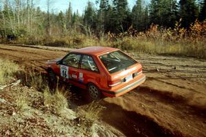 Gail Truess / Pattie Hughes Mazda 323GTX at speed near the end of SS17, Gratiot Lake II.