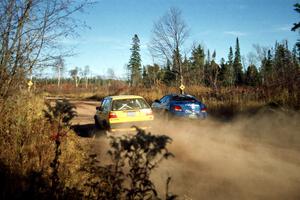 Art Burmeister / Bob Martin VW GTI passes the Perry King / Mark Williams Hyundai Tiburon near the end of SS17, Gratiot Lake II.