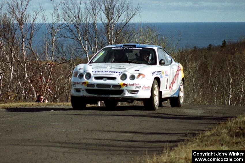 Paul Choiniere / Jeff Becker Hyundai Tiburon at the final yump on SS13, Brockway Mountain.