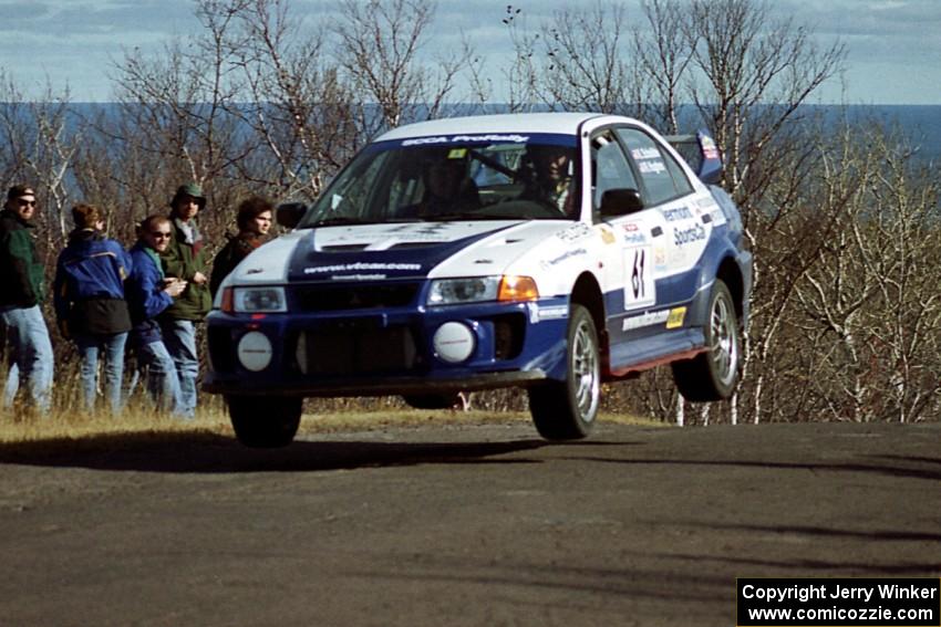 Karl Scheible / Russ Hughes Mitsubishi Lancer Evo V at the final yump on SS13, Brockway Mountain.