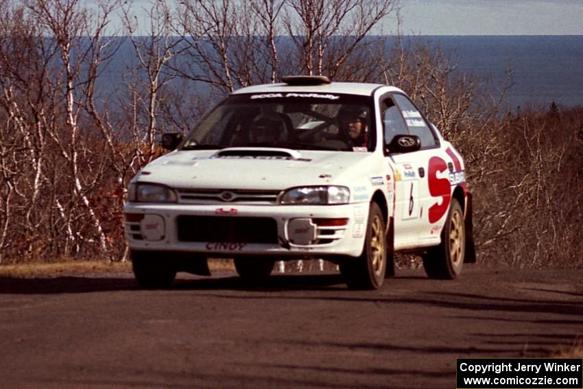 Henry Krolikowski / Cindy Krolikowski Subaru WRX STi at the final yump on SS13, Brockway Mountain.