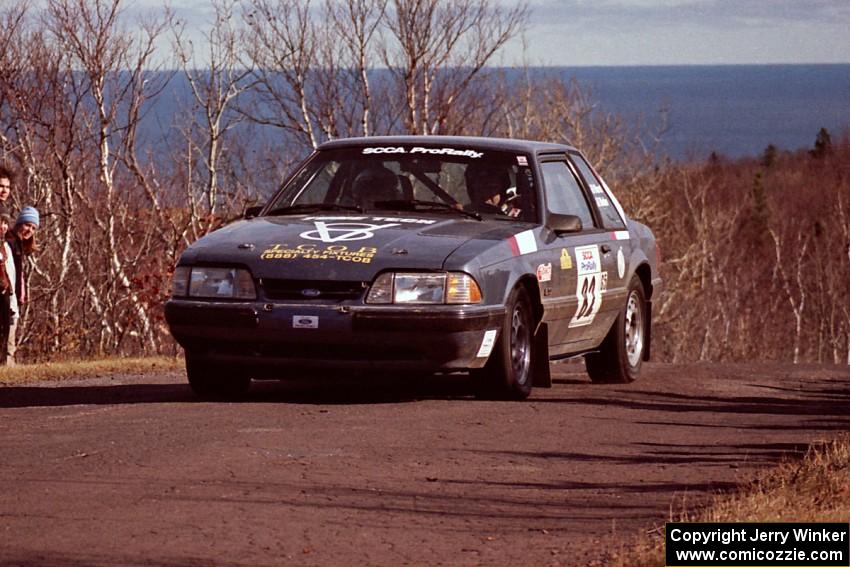 Mike Hurst / Rob Bohn Ford Mustang at the final yump on SS13, Brockway Mountain.