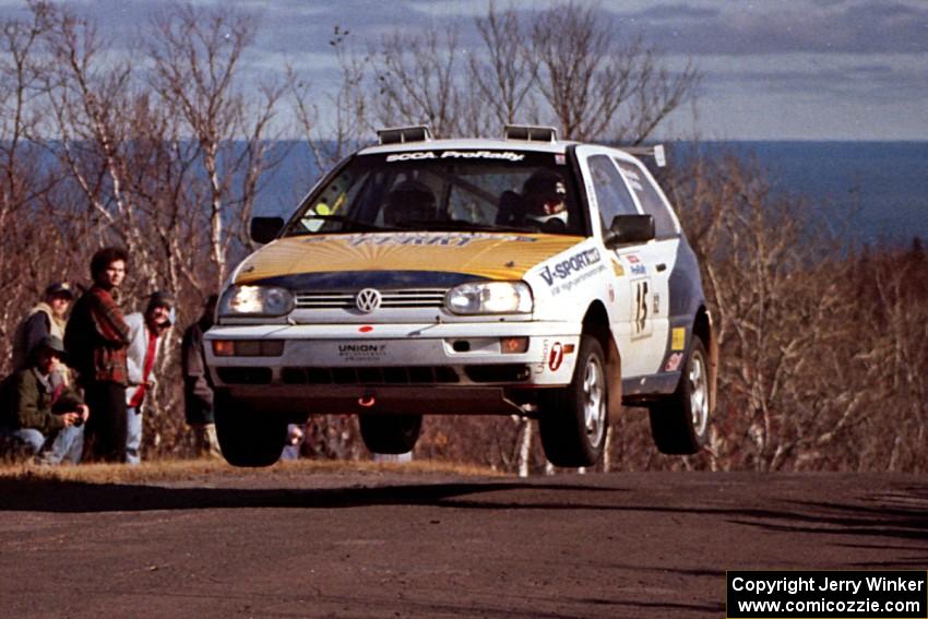 Brad Hawkins / Adrian Wintle VW GTI at the final yump on SS13, Brockway Mountain.