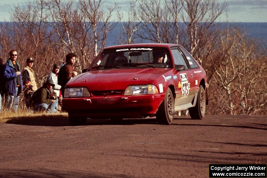 Jeremy Butts / Jon Vrzal Ford Mustang GT at the final yump on SS13, Brockway Mountain.