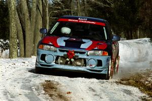 Alec Ellsworth /	Steve Kaczkowski Mitsubishi Lancer Evo IV sets up for the hairpin on SS5, Ranch II.