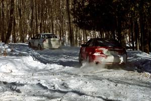 Shane Mitchell / Paul Donnelly Eagle Talon about to pass the Tim Paterson / Scott Ferguson Mitsubishi Lancer Evo IV on SS5.