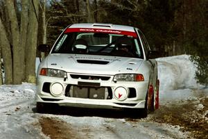 Paul Dunn / Rebecca Dunn Mitsubishi Lancer Evo IV sets up for the hairpin on SS5, Ranch II.