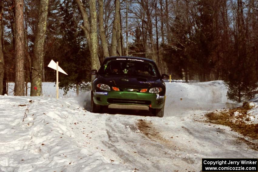 Tad Ohtake / Bob Martin Ford Escort ZX2 sets up for the hairpin on SS5, Ranch II.