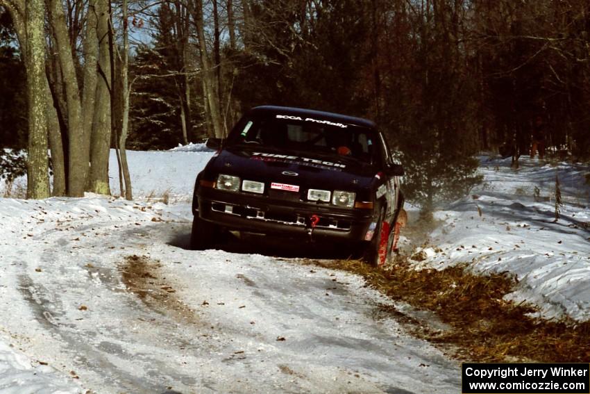 Mike Hurst / Rob Bohn Pontiac Sunbird Turbo sets up for the hairpin on SS5, Ranch II.