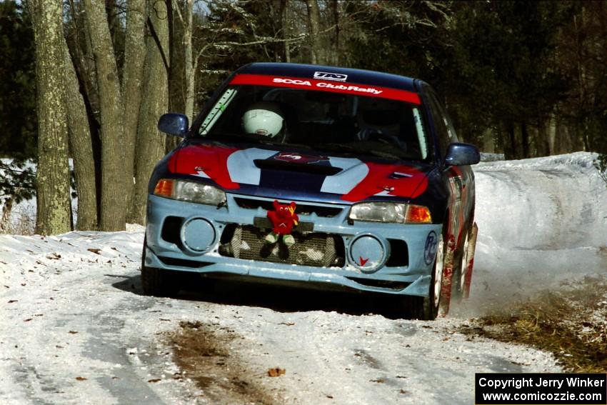 Alec Ellsworth /	Steve Kaczkowski Mitsubishi Lancer Evo IV sets up for the hairpin on SS5, Ranch II.