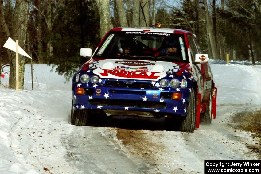 Kurosh Jahromi / Tony Lumino Ford Escort Cosworth RS sets up for the hairpin on SS5, Ranch II.