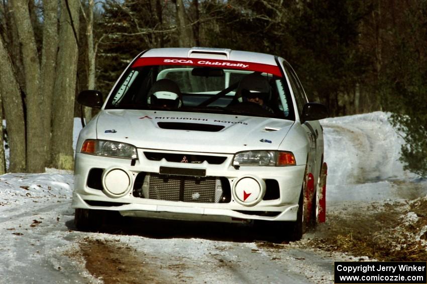Paul Dunn / Rebecca Dunn Mitsubishi Lancer Evo IV sets up for the hairpin on SS5, Ranch II.