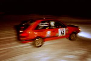 Gail Truess / Pattie Hughes-Mayer Mazda 323GTX at the spectator corner on SS13, Meaford/DeCheau Lake.