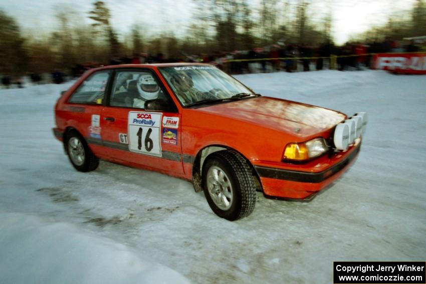 Gail Truess / Pattie Hughes-Mayer Mazda 323GTX at the spectator corner on SS11, Hungry 5.