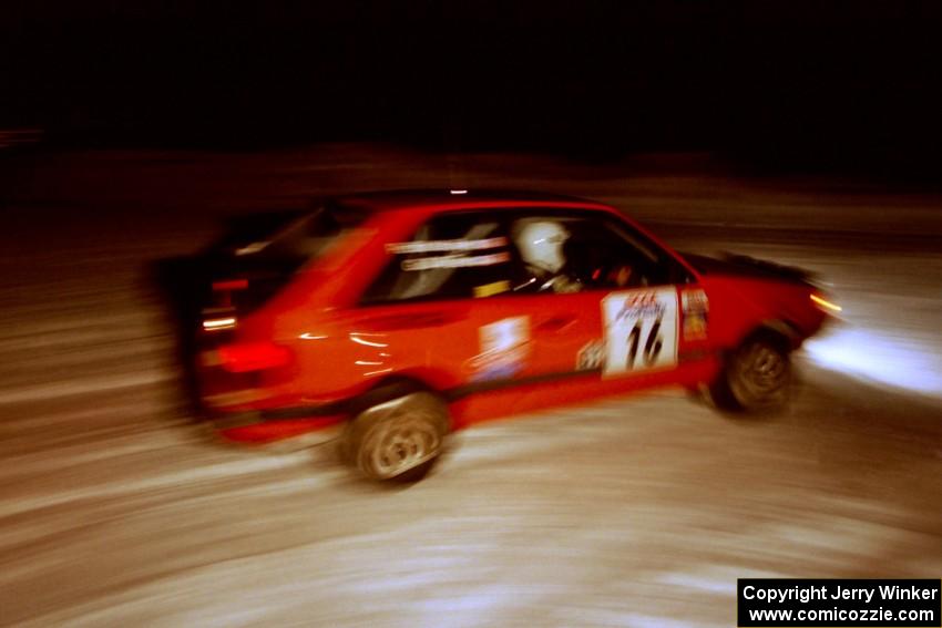 Gail Truess / Pattie Hughes-Mayer Mazda 323GTX at the spectator corner on SS13, Meaford/DeCheau Lake.