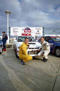 Richard Tuthill / John Bennie pose in front of their winning Mitsubishi Lancer Evo IV.