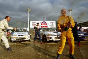 The winners' ceremonial champagne spray.