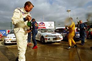 The winners' ceremonial champagne spray.