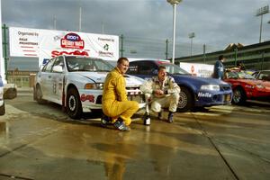 Richard Tuthill / John Bennie pose in front of their winning Mitsubishi Lancer Evo IV.