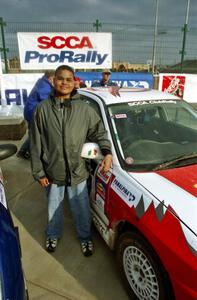 A 14-year old Alex Kihurani stands next to the Noel Nash / Patrick McGrath Mitsubishi Lancer Evo IV.