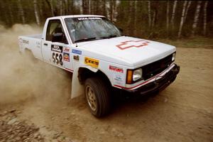 Jim Cox / Kaari Cox drift their Chevy S-10 Pickup through a 90-right on Indian Creek Rd., SS1.