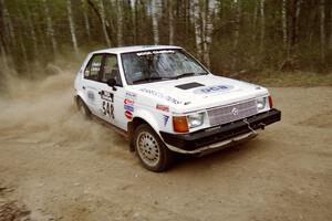 John Zoerner / John Shepski drift their Dodge Omni GLH Turbo through a 90-right on Indian Creek Rd., SS1.