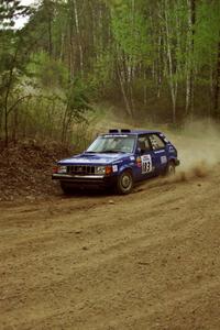 Mary Utecht / Heidi Meyers drift their Dodge Omni GLH Turbo through a 90-right on Indian Creek Rd., SS1.