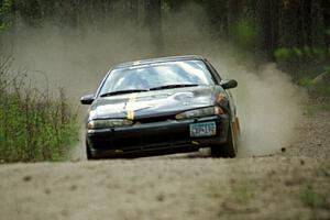 Steve Nielsen / Garrett Sturzl at speed in the Two Inlets State Forest in their Plymoth Laser.