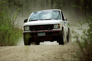 Jim Cox / Kaari Cox were still at speed in the Two Inlets State Forest in their Chevy S-10 Pickup even after rolling.