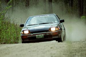 Pete Mathewson / Susan Mathewson at speed in the Two Inlets State Forest in their Honda CRX.